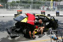 18.07.2004 Shanghai, China,  DTM, Sunday, Abt mechanics check the water level of one of the Audi A4 DTM cars which is completely stripped - DTM Season 2004 at Pu Dong Street Circuit Shanghai (Deutsche Tourenwagen Masters)