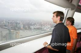 15.07.2004 Shanghai, China,  DTM, Thursday, DTM drivers Jeroen Bleekemolen (NED), OPC Euroteam, Portrait (left) and Markus Winkelhock (GER), Original-Teile AMG-Mercedes, Portrait (right), enjoying the view from a 350-meter high viewing point on the 468-meter high Oriental Pearl TV tower - DTM Season 2004 at Pu Dong Street Circuit Shanghai (Deutsche Tourenwagen Masters)