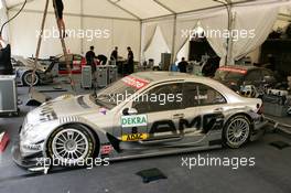 15.07.2004 Shanghai, China,  DTM, Thursday, The car of Jean Alesi (FRA), AMG-Mercedes, AMG-Mercedes C-Klasse, in the HWA pitbox tent where still a lot of working has to be done - DTM Season 2004 at Pu Dong Street Circuit Shanghai (Deutsche Tourenwagen Masters)