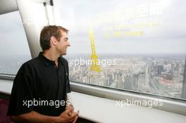 15.07.2004 Shanghai, China,  DTM, Thursday, DTM drivers Jeroen Bleekemolen (NED), OPC Euroteam, Portrait (left) enjoys the view from the 350-meter high viewing point on the 468-meter high Oriental Pearl TV tower - DTM Season 2004 at Pu Dong Street Circuit Shanghai (Deutsche Tourenwagen Masters)