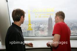 15.07.2004 Shanghai, China,  DTM, Thursday, DTM drivers Jeroen Bleekemolen (NED), OPC Euroteam, Portrait (left) and Stefan Mücke (GER), CLK AMG-Mercedes, Portrait (right) enjoy the view from the 350-meter high viewing point on the 468-meter high Oriental Pearl TV tower - DTM Season 2004 at Pu Dong Street Circuit Shanghai (Deutsche Tourenwagen Masters)