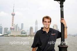 15.07.2004 Shanghai, China,  DTM, Thursday, DTM driver Jeroen Bleekemolen (NED), OPC Euroteam, Portrait, posing for the Huangpu river, with in the background the 468-meter high Oriental Pearl TV tower and the Oriental Riverside Hotel - DTM Season 2004 at Pu Dong Street Circuit Shanghai (Deutsche Tourenwagen Masters)