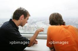 15.07.2004 Shanghai, China,  DTM, Thursday, DTM drivers Jeroen Bleekemolen (NED), OPC Euroteam, Portrait (left) and Markus Winkelhock (GER), Original-Teile AMG-Mercedes, Portrait (right) enjoy the view from the 350-meter high viewing point on the 468-meter high Oriental Pearl TV tower - DTM Season 2004 at Pu Dong Street Circuit Shanghai (Deutsche Tourenwagen Masters)