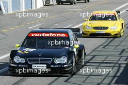 15.03.2004 Estoril, Portugal,  The new 2004 (front) and the old 2003 (back) AMG Mercedes DTM car together. In front:Bernd Schneider (GER), Vodafone AMG-Mercedes, Mercedes-Benz C-Class DTM, in the back: Jaroslav Janis (CZE), AMG-Mercedes, Mercedes-Benz CLK-DTM - DTM Test Estoril, Circuito do Estoril, Portugal