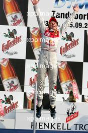 05.09.2004 Zandvoort, The Netherlands,  DTM, Sunday, Podium, Mattias Ekström (SWE), Audi Sport Team Abt, Portrait, jumps on to the podium - DTM Season 2004 at Circuit Park Zandvoort (Deutsche Tourenwagen Masters)