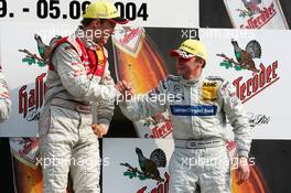 05.09.2004 Zandvoort, The Netherlands,  DTM, Sunday, Podium, Christijan Albers (NED), DaimlerChrysler Bank AMG-Mercedes, Portrait (3rd, right), congratulates Mattias Ekström (SWE), Audi Sport Team Abt, Portrait (1st, left) - DTM Season 2004 at Circuit Park Zandvoort (Deutsche Tourenwagen Masters)