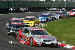 05.09.2004 Zandvoort, The Netherlands,  DTM, Sunday, Bernd Schneider (GER), Vodafone AMG-Mercedes, AMG-Mercedes C-Klasse, leading a group of cars at the restart - DTM Season 2004 at Circuit Park Zandvoort (Deutsche Tourenwagen Masters)