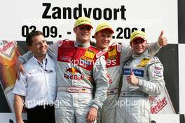 05.09.2004 Zandvoort, The Netherlands,  DTM, Sunday, Podium, Mattias Ekström (SWE), Audi Sport Team Abt, Portrait (1st, center), Martin Tomczyk (GER), Audi Sport Team Abt, Portrait (2nd, left) and Christijan Albers (NED), DaimlerChrysler Bank AMG-Mercedes, Portrait (3rd, right) - DTM Season 2004 at Circuit Park Zandvoort (Deutsche Tourenwagen Masters)