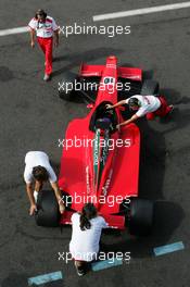10.09.2004 Dijon, France, Friday 10 September 2004, Mechanics of Scuderia Fama pull the car of Jean de Pourtales, FRA, Scuderia Fama, back into the pitbox - SUPERFUND EURO 3000 Championship Rd 7, Circuit Dijon-Prenois, France, FRA - SUPERFUND COPYRIGHT FREE editorial use only