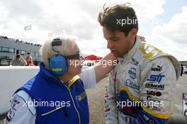 12.09.2004 Dijon, France, Sunday 12 September 2004, Fausto Ippoliti, ITA, Draco Racing Jr. team, portrait (right), getting some peptalk from Nadia, from Draco Racing - SUPERFUND EURO 3000 Championship Rd 7, Circuit Dijon-Prenois, France, FRA - SUPERFUND COPYRIGHT FREE editorial use only
