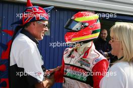 12.09.2004 Dijon, France, Sunday 12 September 2004, Alex Lloyd, GBR, John Village Automotive, portrait (1st), being congratulated by one of his mechanics wearing a funny hat with the colors of the British flag - SUPERFUND EURO 3000 Championship Rd 7, Circuit Dijon-Prenois, France, FRA - SUPERFUND COPYRIGHT FREE editorial use only
