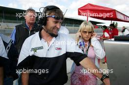 12.09.2004 Dijon, France, Sunday 12 September 2004, The team of John Village Automotive following the race closely on a monitor on the pitwall - SUPERFUND EURO 3000 Championship Rd 7, Circuit Dijon-Prenois, France, FRA - SUPERFUND COPYRIGHT FREE editorial use only