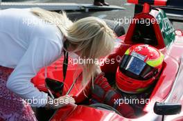 12.09.2004 Dijon, France, Sunday 12 September 2004, Alex Lloyd, GBR, John Village Automotive, being congratulated with his first victory by his girlfriend Sam - SUPERFUND EURO 3000 Championship Rd 7, Circuit Dijon-Prenois, France, FRA - SUPERFUND COPYRIGHT FREE editorial use only