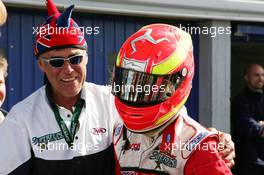 12.09.2004 Dijon, France, Sunday 12 September 2004, Race winner Alex Lloyd, GBR, John Village Automotive, receiving congratulations from one his mechanics who wears a funny hat with the colors of the British flag - SUPERFUND EURO 3000 Championship Rd 7, Circuit Dijon-Prenois, France, FRA - SUPERFUND COPYRIGHT FREE editorial use only