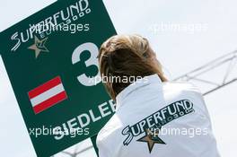 30.05.2004 Estoril, Portugal, Sunday 30 May 2004, SUPERFUND grid girl with the sign for polesitter Norbert Siedler, AUT, ADM Motorsport - SUPERFUND EURO 3000 Championship Rd 2, Estoril, Portugal, PRT - SUPERFUND COPYRIGHT FREE editorial use only