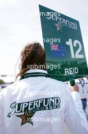30.05.2004 Estoril, Portugal, Sunday 30 May 2004, Grid girl with the sign of Jonathan Reid, NZL, John Village Automotive - SUPERFUND EURO 3000 Championship Rd 2, Estoril, Portugal, PRT - SUPERFUND COPYRIGHT FREE editorial use only