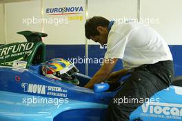 17.07.2004 Spa, Belgium, Saturday 17 July 2004, Bernard Auinger, AUT,  Euronova gets strapped into the car - SUPERFUND EURO 3000 Championship Rd 5, Spa Francorchamps, Belgium, BEL - SUPERFUND COPYRIGHT FREE editorial use only