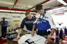 18.07.2004 Spa, Belgium, Sunday 18 July 2004, Norbert Siedler, AUT, ADM Motorsport goes through his notes - SUPERFUND EURO 3000 Championship Rd 5, Spa Francorchamps, Belgium, BEL - SUPERFUND COPYRIGHT FREE editorial use only