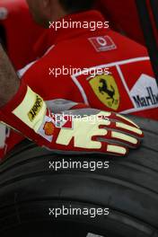 05.03.2004 Melbourne, Australia, F1, Friday, March, Ferrari Mechanic glove. Formula 1 World Championship, Rd 1, Australian Grand Prix. www.xpb.cc, EMail: info@xpb.cc - copy of publication required for printed pictures. Every used picture is fee-liable. c Copyright: photo4 / xpb.cc - LEGAL NOTICE: THIS PICTURE IS NOT FOR ITALY  AND GREECE  PRINT USE, KEINE PRINT BILDNUTZUNG IN ITALIEN  UND  GRIECHENLAND!
