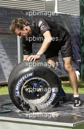 05.03.2004 Melbourne, Australia, F1, Friday, March, McLaren Truckie cleans the Michelin tyres. Formula 1 World Championship, Rd 1, Australian Grand Prix. www.xpb.cc, EMail: info@xpb.cc - copy of publication required for printed pictures. Every used picture is fee-liable. c Copyright: xpb.cc