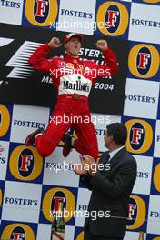 07.03.2004 Melbourne, Australia, F1, Sunday, March, Podium, Michael Schumacher, GER, Ferrari leaps into the air whilst celebrating his first win of 2004. Formula 1 World Championship, Rd 1, Australian Grand Prix. www.xpb.cc, EMail: info@xpb.cc - copy of publication required for printed pictures. Every used picture is fee-liable. c Copyright: reporter images / xpb.cc - LEGAL NOTICE: THIS PICTURE IS NOT FOR GREECE PRINT USE, KEINE PRINT BILDNUTZUNG IN GRIECHENLAND!