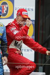 07.03.2004 Melbourne, Australia, F1, Sunday, March, Podium, Michael Schumacher, GER, Ferrari celebrates his first win of 2004.  Formula 1 World Championship, Rd 1, Australian Grand Prix. www.xpb.cc, EMail: info@xpb.cc - copy of publication required for printed pictures. Every used picture is fee-liable. c Copyright: xpb.cc