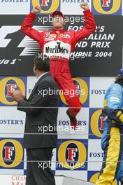 07.03.2004 Melbourne, Australia, F1, Sunday, March, Podium, Michael Schumacher, GER, Ferrari celebrates his first win of 2004.. Formula 1 World Championship, Rd 1, Australian Grand Prix. www.xpb.cc, EMail: info@xpb.cc - copy of publication required for printed pictures. Every used picture is fee-liable. c Copyright: xpb.cc