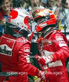 07.03.2004 Melbourne, Australia, F1, Sunday, March, Michael Schumacher, GER, Ferrari, with Rubens Barrichello, BRA, Ferrari, in the Park Ferme, Formula 1 World Championship, Rd 1, Australian Grand Prix. www.xpb.cc, EMail: info@xpb.cc - copy of publication required for printed pictures. Every used picture is fee-liable. c Copyright: xpb.cc