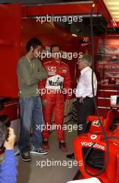 07.03.2004 Melbourne, Australia, F1, Sunday, March, Moto GP world champion Valentino Rossi (ITA) talks with Michael Schumacher, GER, Ferrari and Bernie Ecclestone, GBR. Formula 1 World Championship, Rd 1, Australian Grand Prix. www.xpb.cc, EMail: info@xpb.cc - copy of publication required for printed pictures. Every used picture is fee-liable. c Copyright: photo4 / xpb.cc - LEGAL NOTICE: THIS PICTURE IS NOT FOR ITALY  AND GREECE  PRINT USE, KEINE PRINT BILDNUTZUNG IN ITALIEN  UND  GRIECHENLAND!