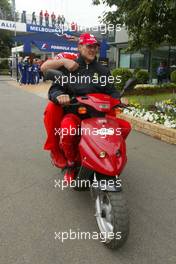 07.03.2004 Melbourne, Australia, F1, Sunday, March, Michael Schumacher, GER, Ferrari rides on a scooter, moped. Formula 1 World Championship, Rd 1, Australian Grand Prix. www.xpb.cc, EMail: info@xpb.cc - copy of publication required for printed pictures. Every used picture is fee-liable. c Copyright: xpb.cc