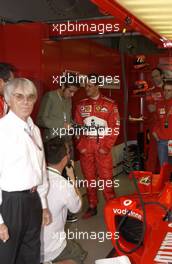 07.03.2004 Melbourne, Australia, F1, Sunday, March, Moto GP world champion Valentino Rossi (ITA) talks with Michael Schumacher, GER, Ferrari . Formula 1 World Championship, Rd 1, Australian Grand Prix. www.xpb.cc, EMail: info@xpb.cc - copy of publication required for printed pictures. Every used picture is fee-liable. c Copyright: photo4 / xpb.cc - LEGAL NOTICE: THIS PICTURE IS NOT FOR ITALY  AND GREECE  PRINT USE, KEINE PRINT BILDNUTZUNG IN ITALIEN  UND  GRIECHENLAND!