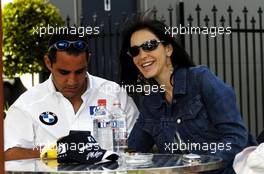 04.03.2004 Melbourne, Australia, F1, Thursday, March, Connie Montoya, Wife of Juan Pablo Montoya, has some fun while Juan-Pablo Montoya, COL, BMW WilliamsF1 plays on a Nintendo gameboy. Formula 1 World Championship, Rd 1, Australian Grand Prix. www.xpb.cc, EMail: info@xpb.cc - copy of publication required for printed pictures. Every used picture is fee-liable. c Copyright: xpb.cc