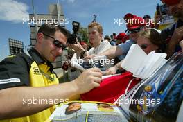 04.03.2004 Melbourne, Australia, F1, Thursday, March, Timo Glock, GER, Test Driver Jordan signs a few autographs for his new fans. Formula 1 World Championship, Rd 1, Australian Grand Prix. www.xpb.cc, EMail: info@xpb.cc - copy of publication required for printed pictures. Every used picture is fee-liable. c Copyright: xpb.cc