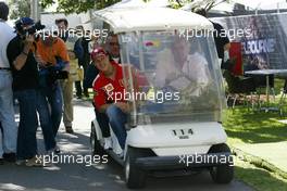 04.03.2004 Melbourne, Australia, F1, Thursday, March, Ron Walker, AUS, Australian Grand Prix Corporation Chairman drives Michael Schumacher, GER, Ferrari and Willi Weber, GER, Driver - Manager around in a golf cart. Formula 1 World Championship, Rd 1, Australian Grand Prix. www.xpb.cc, EMail: info@xpb.cc - copy of publication required for printed pictures. Every used picture is fee-liable. c Copyright: photo4 / xpb.cc - LEGAL NOTICE: THIS PICTURE IS NOT FOR ITALY  AND GREECE  PRINT USE, KEINE PRINT BILDNUTZUNG IN ITALIEN  UND  GRIECHENLAND! 