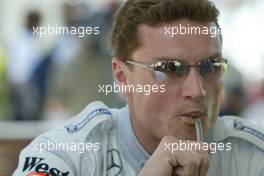 04.03.2004 Melbourne, Australia, F1, Thursday, March, David Coulthard, GBR, McLaren Mercedes keeps refreshed. Formula 1 World Championship, Rd 1, Australian Grand Prix. www.xpb.cc, EMail: info@xpb.cc - copy of publication required for printed pictures. Every used picture is fee-liable. c Copyright: xpb.cc