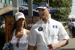 04.03.2004 Melbourne, Australia, F1, Thursday, March, Ralf Schumacher, GER, BMW WilliamsF1 with Cora Schumacher, GER, Wife of Ralf Schumacher. Formula 1 World Championship, Rd 1, Australian Grand Prix. www.xpb.cc, EMail: info@xpb.cc - copy of publication required for printed pictures. Every used picture is fee-liable. c Copyright: photo4 / xpb.cc - LEGAL NOTICE: THIS PICTURE IS NOT FOR ITALY  AND GREECE  PRINT USE, KEINE PRINT BILDNUTZUNG IN ITALIEN  UND  GRIECHENLAND! 