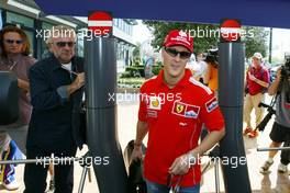 04.03.2004 Melbourne, Australia, F1, Thursday, March, Michael Schumacher, GER, Ferrari arrives at the circuit with Willi Weber, GER, Driver - Manager. Formula 1 World Championship, Rd 1, Australian Grand Prix. www.xpb.cc, EMail: info@xpb.cc - copy of publication required for printed pictures. Every used picture is fee-liable. c Copyright: xpb.cc