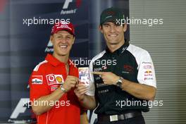 04.03.2004 Melbourne, Australia, F1, Thursday, March,Official FIA Press conference, Michael Schumacher, GER, Ferrari and Mark Webber, AUS, Jaguar  with a Mark Webber helmet pin.  Money raised from the pins is going to charity and a few lucky winners will get to meet these two drivers to name a few. Formula 1 World Championship, Rd 1, Australian Grand Prix. www.xpb.cc, EMail: info@xpb.cc - copy of publication required for printed pictures. Every used picture is fee-liable. c Copyright: xpb.cc