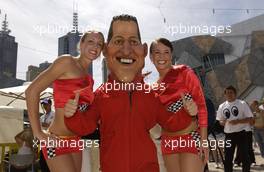 03.03.2004 Melbourne, Australia, F1, Wednesday, March, A Michael Schumacher, GER, Ferrari  look a like poses with a couple of Australian Girls. Formula 1 World Championship, Rd 1, Australian Grand Prix preparations. www.xpb.cc, EMail: info@xpb.cc - copy of publication required for printed pictures. Every used picture is fee-liable. c Copyright: xpb.cc