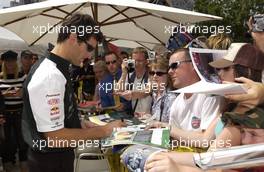 03.03.2004 Melbourne, Australia, F1, Wednesday, March, Fan Event in front of the Exibition Center, Mark Webber, AUS, Jaguar, signs a few autographs. Formula 1 World Championship, Rd 1, Australian Grand Prix preperations. www.xpb.cc, EMail: info@xpb.cc - copy of publication required for printed pictures. Every used picture is fee-liable. c Copyright: xpb.cc