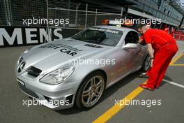 03.03.2004 Melbourne, Australia, F1, Wednesday, March, a couple of Ferrari check out the  Brand new Mercedes SLK 55 AMG FIA safety car for the 2004 season. Formula 1 World Championship, Rd 1, Australian Grand Prix preparations. www.xpb.cc, EMail: info@xpb.cc - copy of publication required for printed pictures. Every used picture is fee-liable. c Copyright: xpb.cc