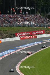 29.08.2004 Spa-Francorchamps, Belgium, F1, Sunday, August, Kimi Raikkonen, FIN, Räikkönen, West McLaren Mercedes, MP4-19B, Action, Track leads Michael Schumacher, GER, Scuderia Ferrari Marlboro, F2004, Action, Track - Formula 1 World Championship, Rd 14, Race,  Belgium Grand Prix, BEL, Belgium