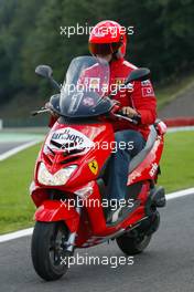 26.08.2004 Spa-Francorchamps, Belgium, F1, Thursday, August, Michael Schumacher, GER, Ferrari makes a lap of the circuit on a scooter - Formula 1 World Championship, Rd 14, Belgium Grand Prix, BEL, Belgium