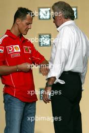 03.04.2004 Manama, Bahrain, F1, Saturday, April, Michael Schumacher, GER, Ferrari, talking with Willi Weber, GER, Driver - Manager, Portrait, Formula 1 World Championship, Rd 3, Bahrain Grand Prix, BHR