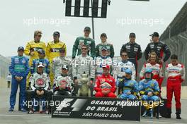 24.10.2004 Interlagos, Brazil, F1, Sunday, October, All the drivers pose for the end of year picture and "donkey" from www.donkeydoesf1.co.uk is sitting in Michael Schumacher's seat- Formula 1 World Championship, Rd 18, Brazilian Grand Prix, BRA, Brazil