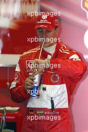 11.06.2004 Montreal, Canada, F1, Friday, June, Michael Schumacher, GER, Ferrari checks the time - Formula 1 World Championship, Practice, Rd 8, Canadian Grand Prix, Canada, CAN