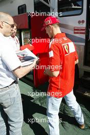 10.06.2004 Montreal, Canada, F1, Thursday, June, Michael Schumacher, GER, Ferrari signs an autograph - Formula 1 World Championship, Rd 8, Canadian Grand Prix,  Canada, CAN