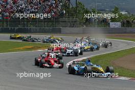 09.05.2004 Barcelona, Spain, F1, Sunday, May, Jarno Trulli, ITA, Renault F1 Team leads Michael Schumacher, GER, Ferrari at The start of the race - Formula 1 World Championship, Rd 5, Marlboro Spanish Grand Prix Race, ESP