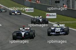 09.05.2004 Barcelona, Spain, F1, Sunday, May, David Coulthard, GRB, West McLaren Mercedes, MP4-19, Action, Track and Ralf Schumacher, GER, BMW WilliamsF1 Team, FW26, Action, Track - Formula 1 World Championship, Rd 5, Marlboro Spanish Grand Prix Race, ESP