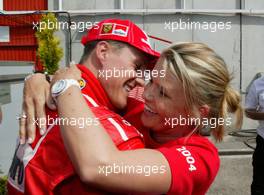 09.05.2004 Barcelona, Spain, F1, Sunday, May, Michael Schumacher, GER, Ferrari, and his wife Corina Schumacher, GER, Corinna, wife of Michael Schumacher, kissing after the race - Formula 1 World Championship, Rd 5, Marlboro Spanish Grand Prix Race, ESP
